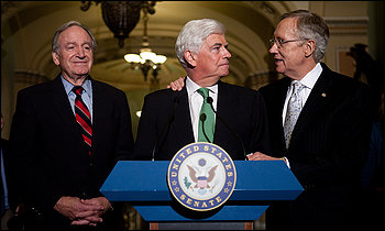 Senate Majority Leader Harry M. Reid (D-Nev.), right, confers with Sen. Christopher J. Dodd (D-Conn.), as Sen. Tom Harkin (D-Iowa) looks on, during a news conference after the 60 to 39 Senate vote.