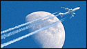 Plane flying past moon