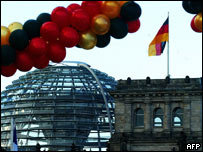 Balloons in the colours of the German flag fly in front of the Reichstag building in Berlin 