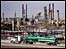 A tanker truck passes in front of Chevron refinery in California